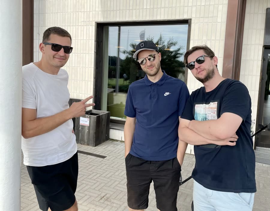 Three of the team outside the office