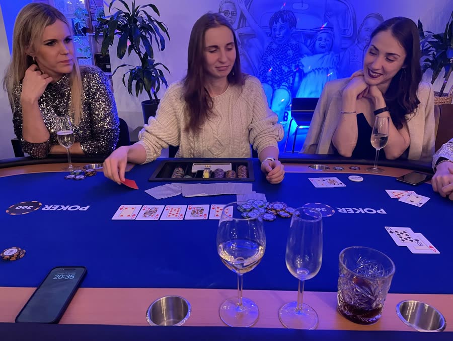 Four of the team at a poker table on a company night out
